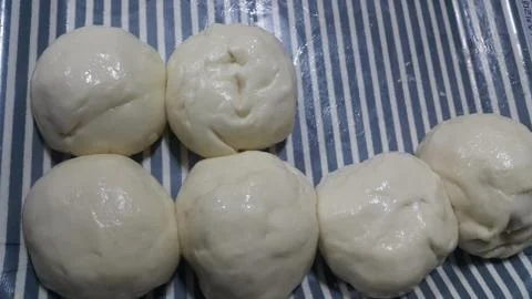 Closeup top view of fresh raw dough ball ready to be baked Stock Photos