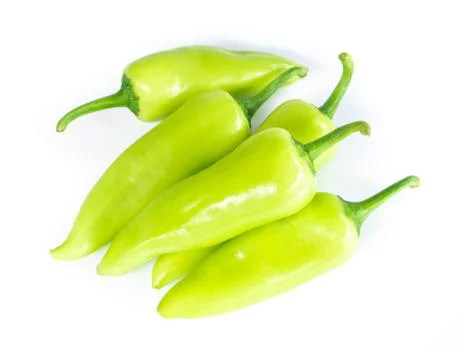 Closeup top view green chilli pepper on white background, raw food ingredient Stock Photos