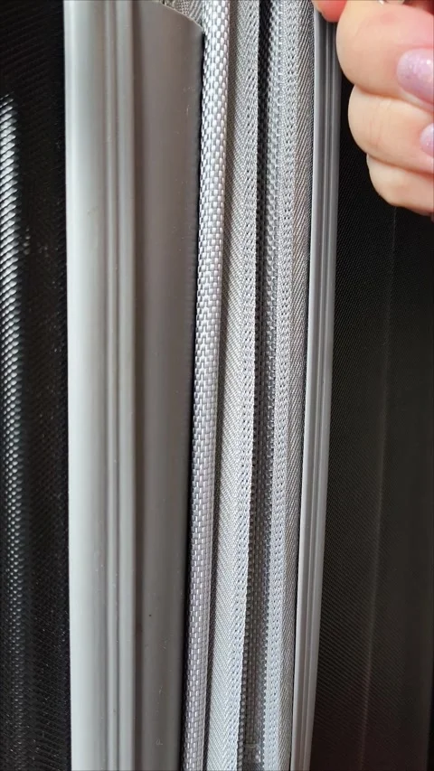 Closeup top view of silver zipper of hard shelled suitcase, new and clean Video stock 313833802