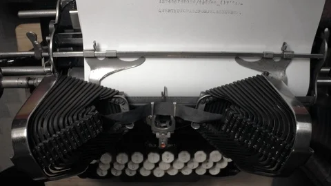Closeup top view on typing batwing typewriter with keyboard and paper. Stock-Footage 89314954
