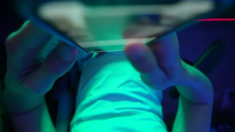 Closeup top view of unrecognizable man holding cellphone in hands, scrolling Video stock 250259991