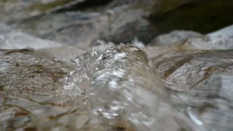 Closeup of the top a waterfall of a mountain river (bokeh, slow motion) Stock Footage 212743494