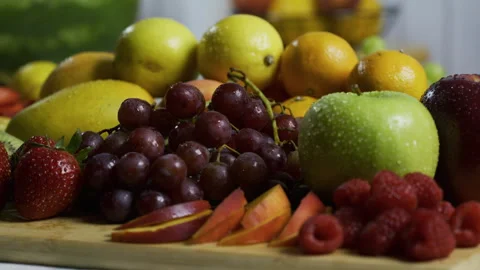 Closeup tracking shot across wet, delicious fruit platter Stock Footage 341190612