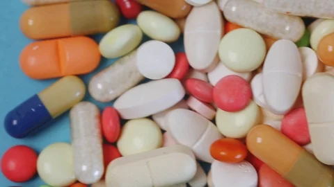 Closeup tracking shot of many different medical pills Stock Footage 97822458