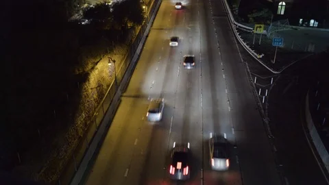 Closeup Traffic driving on freeway at night. Driving away from camera Vidéo 87487505