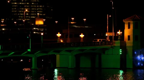 Closeup of traffic over an l.e.d. lit up bridge-GREEN Stock Footage 33547588