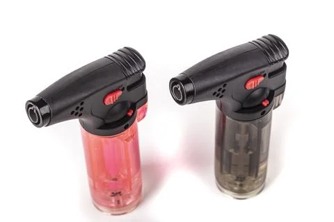 Closeup translucent red torch lighter, studiolit on white background, texture Stock Photos