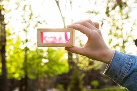 Closeup of transparent shape wooden block toy against the sun Stock Photos