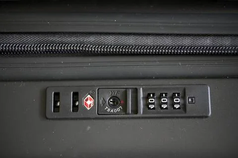 Closeup of a travel suitcase with code and lock. Stock Photos