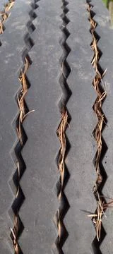 Closeup tread pattern on old rubber tire Foto stock