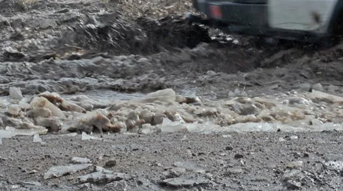 Closeup trush splashing in mud 7172 Stock Footage 10720098