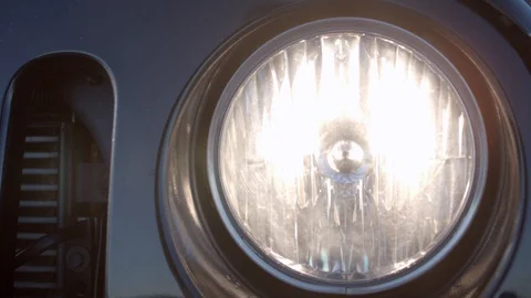 Closeup of the turning off headlight of a car. Video stock 85502013