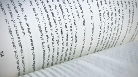 Closeup turning pages of book Video stock 169532226