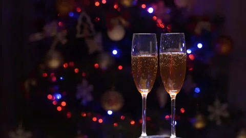 Closeup Of Two Bubbling Champagne Glasses Against The Backdrop Video stock 259045979