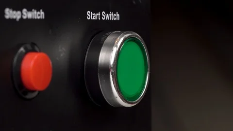 Closeup of two buttons in the frame. Green start switch and red stop switch Video stock 92439429