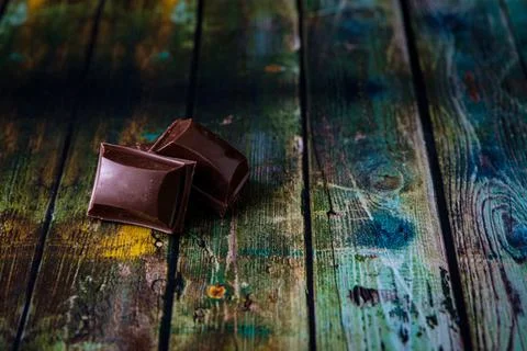 Closeup of two chocolates with dark background Stock Photos