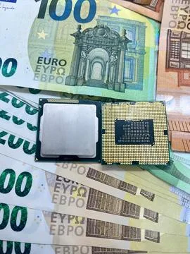 Closeup of two CPU microprocessors on EURO banknotes 200 EUR 100 EUR 50 EU Stock Photos