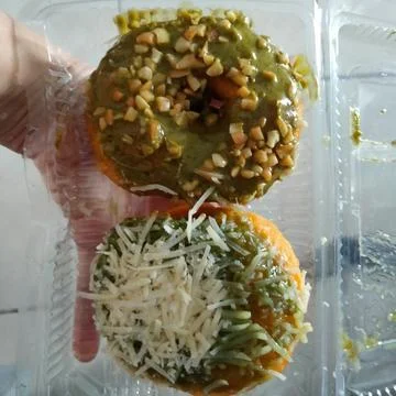 Closeup of two donuts in plastic packaging Stock Photos