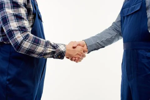 Closeup. Two engineers hold building helmets in their hands. Stock Photos