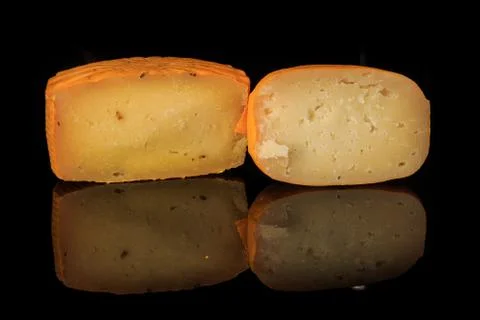 Closeup two halves of different hard yellow cheese heads Stock Photos