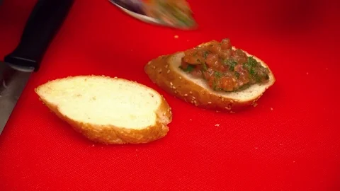 Closeup of two hands making tapas on the kitchen Stock Footage 77025498