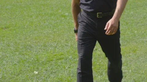 Closeup - Two men shake hands and greet each other in a park - shot on RED Stock Footage 124716698