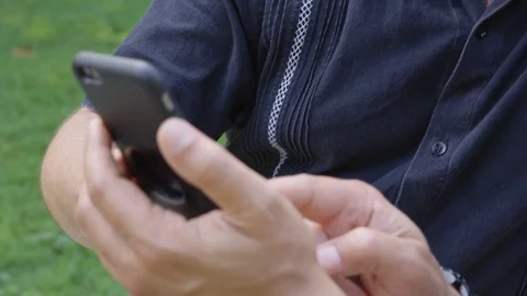 Closeup - Two men stare at something on a phone content and confidently - shot Stock Footage 124717582