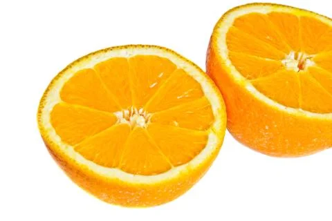 Closeup on two orange halfs Stock Photos