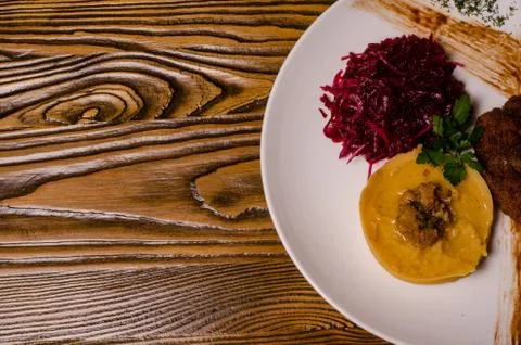 Closeup two pieces of medium raw grilled meat decorated with red pepper and s Stock Photos