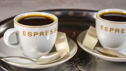 Closeup of two small cups with espresso Stock Photos