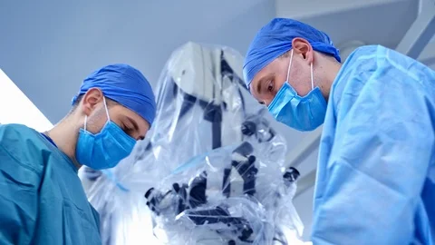 Closeup of two surgeons with operating microscope. Health treatment concept. Stock Footage 119154505