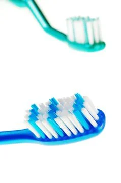 Closeup of two toothbrushes Stock Photos