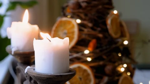 Closeup of two white candles burning. Flame of a candle being blown out. 4K Stock Footage 123278206