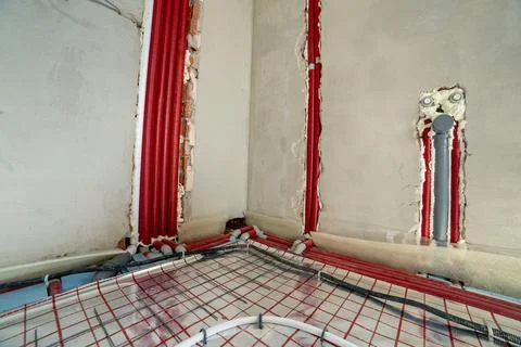 Closeup of underfloor heating pipes installed on insulation before concrete p Stock Photos
