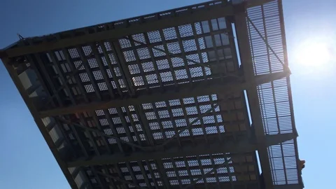 (Closeup) Underside of Rising Drawbridge Against Blue Sky and Bright Sun  Stock Footage 91635903