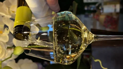 Closeup unknown waiter hand pouring wine into glass indoors. Unrecognizable Stock Footage 265017142