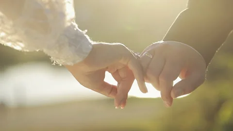 Closeup unrecognizable Bride and Groom holding hands. Unknown newlywed couple Video stock 196006835