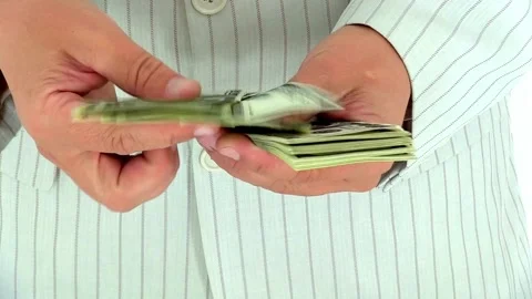Closeup of unrecognizable Businessman hands counting expenses banknotes of Видео 336260927