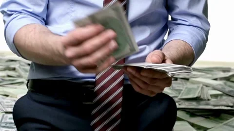 Closeup of unrecognizable Businessman hands counting expenses banknotes of Video stock 336261000