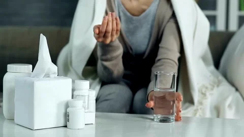 Closeup unrecognizable face shoot of sick ill person taking pill medicine health Stock-Footage 336586145