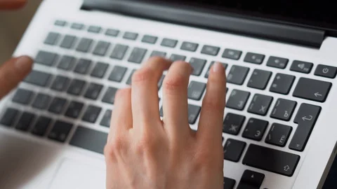 Closeup unrecognizable female hands using laptop keyboard for remote online work Stock Footage 128553032