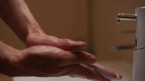 Closeup of unrecognizable man soaping hands in bathroom with modern touchscreen Stock Footage 277466883