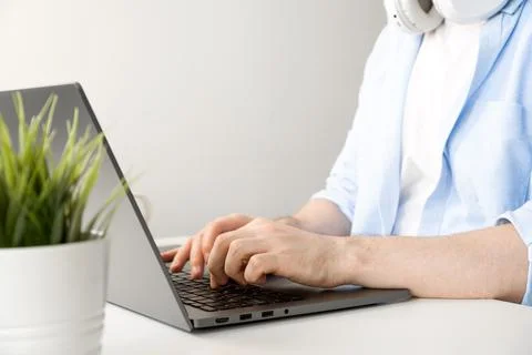 Closeup of unrecognizable man typing on laptop. Working or online education Stock Photos