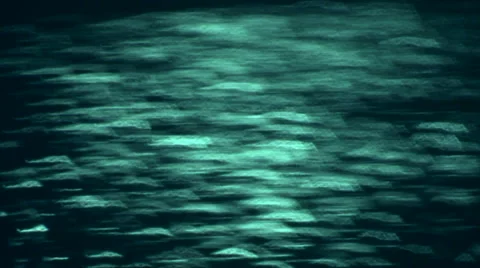 Closeup of unusual teal sparkles on dark background. 動画素材 47012219