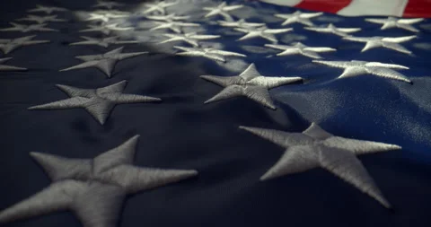 Closeup of USA Flag on Horizontal Surface with Slow Push In Camera Movement 動画素材 346906058