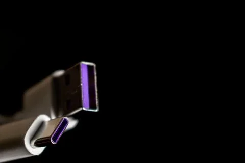 Closeup of USB cable. Isolated on black background Stock Photos