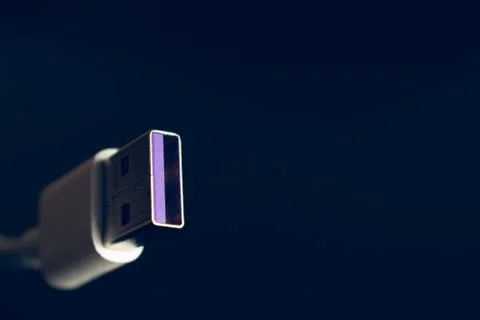 Closeup of USB cable. Isolated on black background Stock Photos