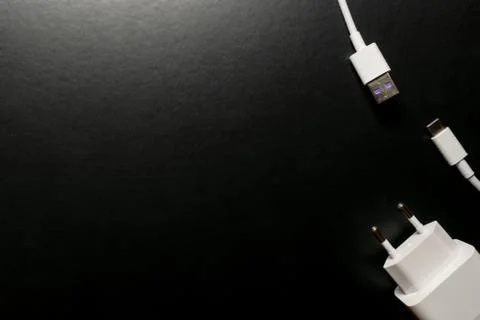 Closeup of USB cable. Isolated on black background Stock Photos