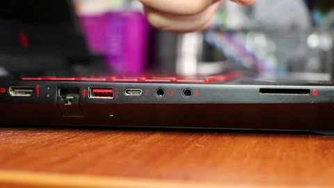 Closeup of usb connector in laptop. Inside the connector is a flash drive. The m Stock Footage 99108376