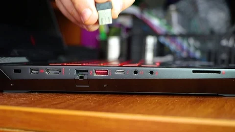 Closeup of usb connector in laptop. Inside the connector is a flash drive. The m Stock Footage 99108388